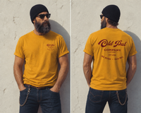 Male model wearing Mustard Old Pal Company Standard Edition T-shirt with blue jeans and vintage-inspired styling