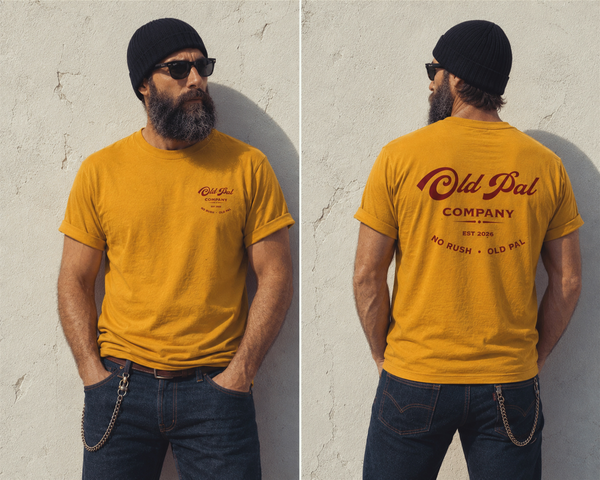 Male model wearing Mustard Old Pal Company Standard Edition T-shirt with blue jeans and vintage-inspired styling