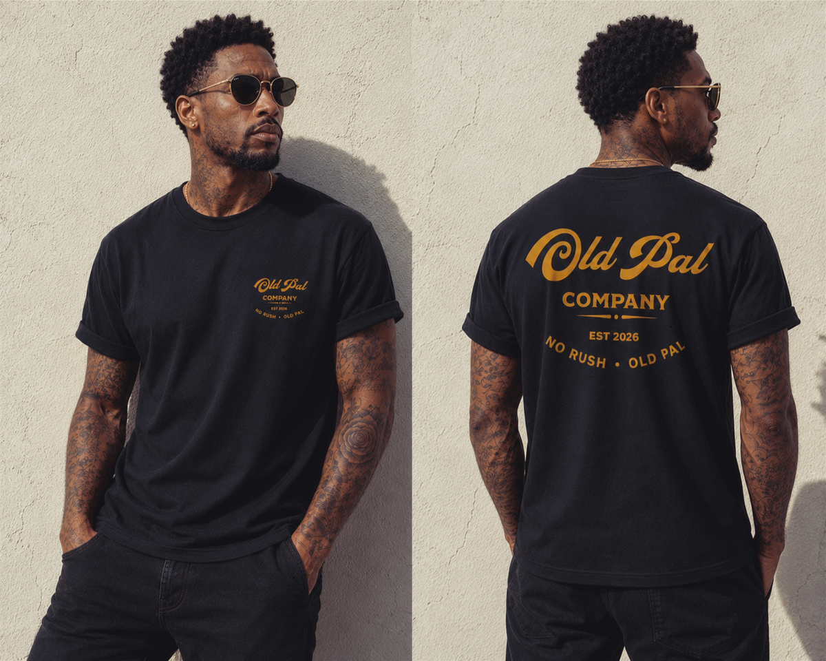 Male model wearing Pitch Black Old Pal Company Standard Edition T-shirt with Black  jeans and vintage-inspired styling