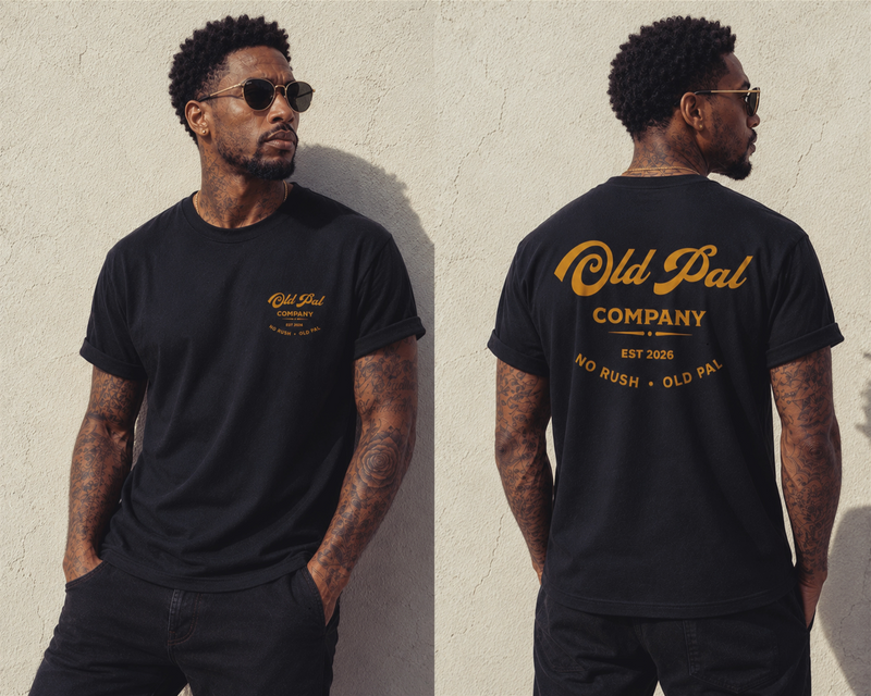 Male model wearing Pitch Black Old Pal Company Standard Edition T-shirt with Black  jeans and vintage-inspired styling