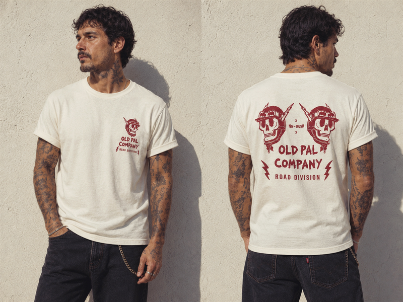 Male model wearing Classic White Old Pal Company Road Division T-shirt with black jeans and vintage-inspired styling