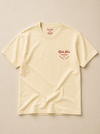 Aged white heavyweight Cotton T-Shirt with red Old Pal Company chest print laid flat on neutral background