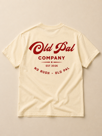 Aged white heavyweight cotton t-shirt with oversized red old pal company graphic laid flat on neutral background