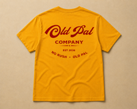 Mustard heavyweight cotton t-shirt with oversized red old pal company graphic laid flat on neutral background