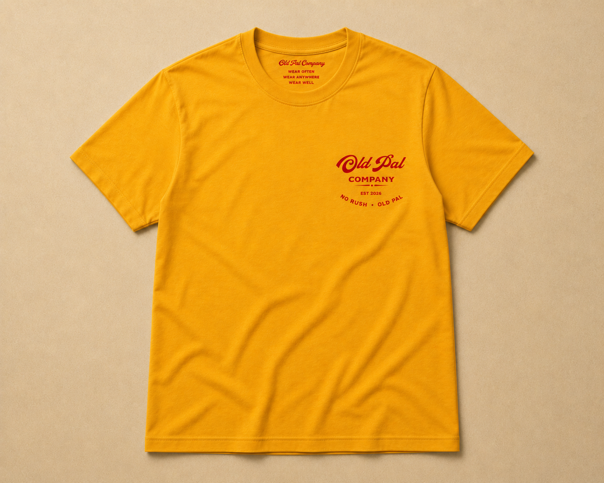 Mustard heavyweight Cotton T-Shirt with red Old Pal Company chest print laid flat on neutral background